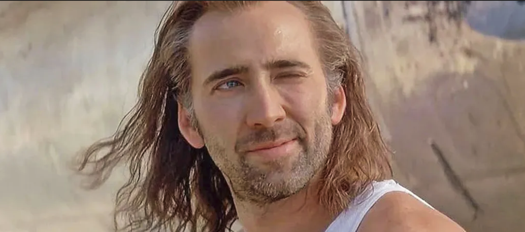 Still frame from the movie Con Air with Nicolas Cage winking at the camera.